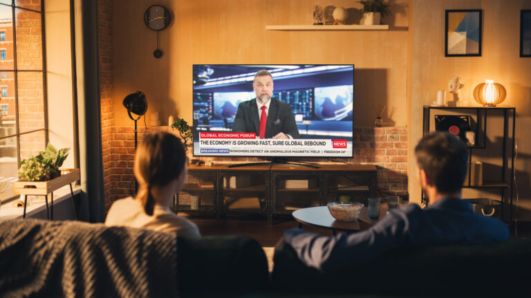 couple-watches-news-broadcast.jpg