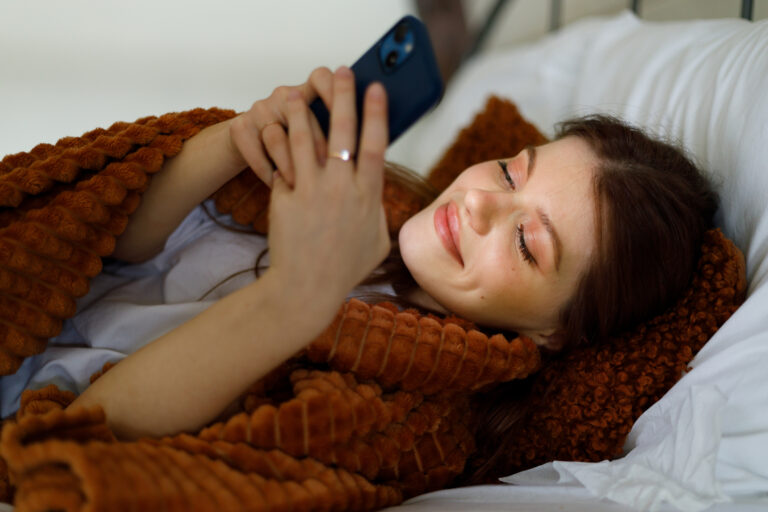 woman-smiles-her-phone.jpg