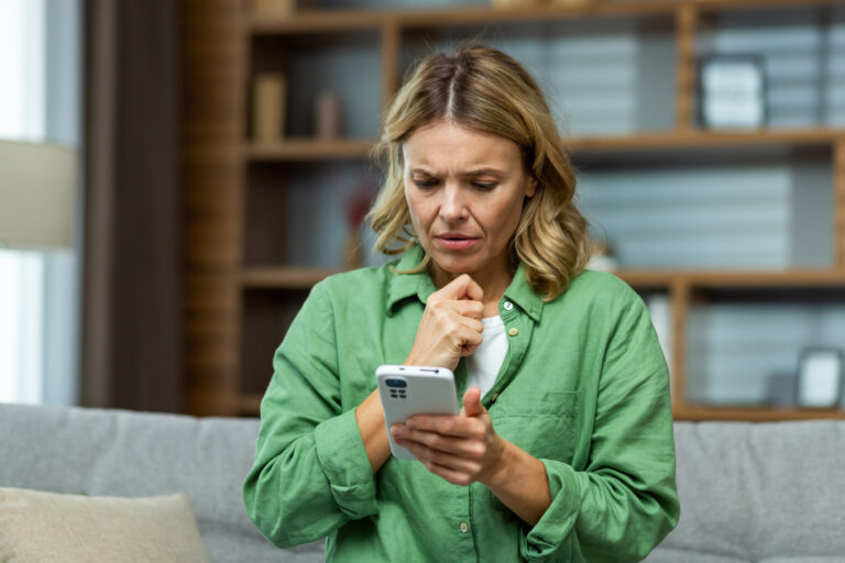 upset-woman-looking-phone.jpg