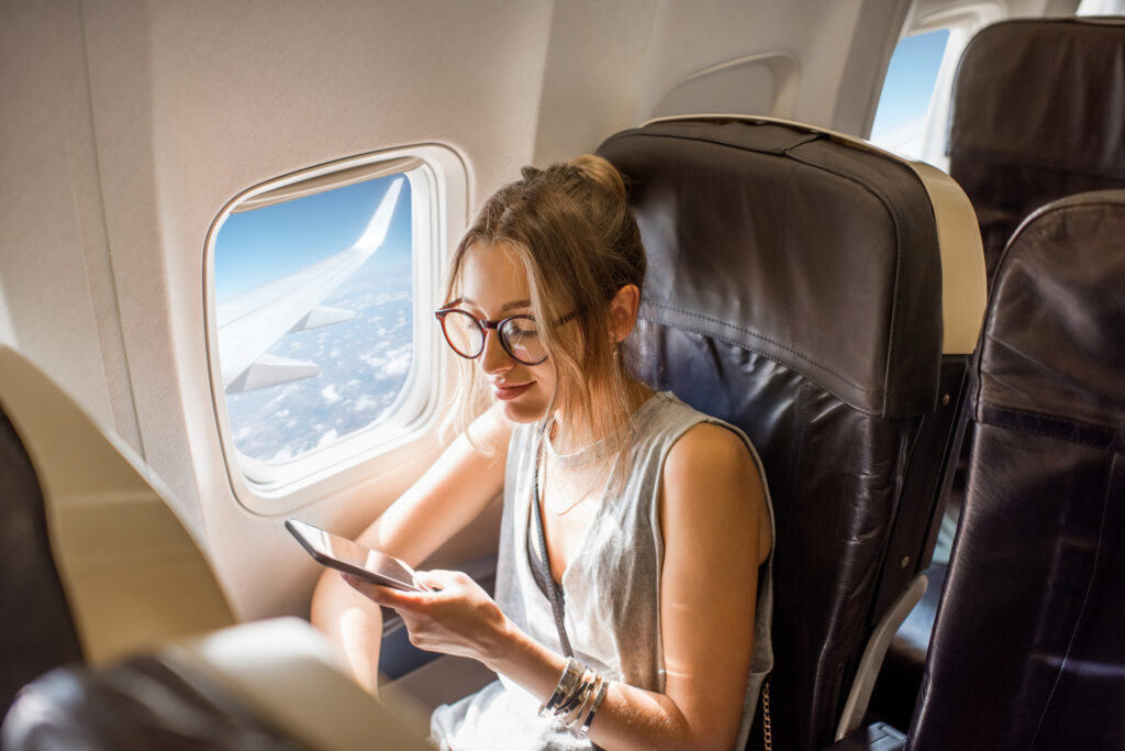 woman-sits-plane-window-seat.jpg